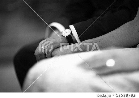 Bride and groom holding hands in wedding marriage ceremony Bride and groom holding hands in wedding marriage ceremony 13539792