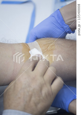 Nurse and male patient blood sample donation 13540008