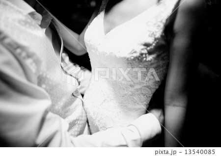 Bride and bridegroom in wedding marriage holding hands 13540085