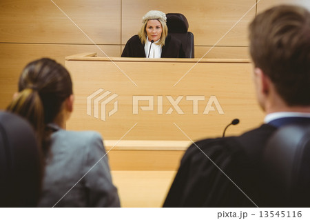 Judge talking with lawyers to make a decision Judge talking with lawyers to make a decision 13545116