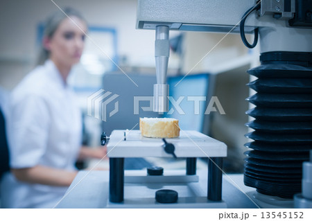 Food scientist using technology to analyse bread Food scientist using technology to analyse bread 13545152
