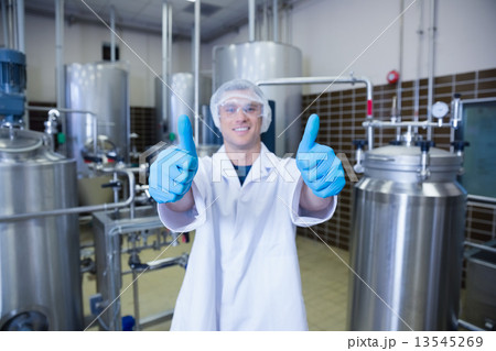 Positive man in lab coat giving thumbs up Positive man in lab coat giving thumbs up 13545269