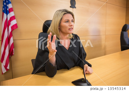 Stern judge speaking to the court Stern judge speaking to the court 13545314