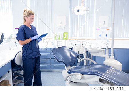 Dentist working on tablet pc 13545544