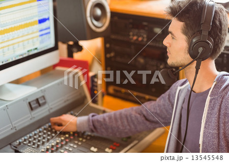 Portrait of an university student mixing audio 13545548