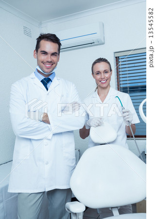 Portrait of smiling dentists Portrait of smiling dentists 13545582