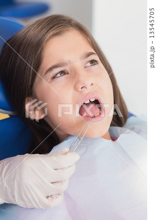 Portrait of a young patient in dental examination 13545705