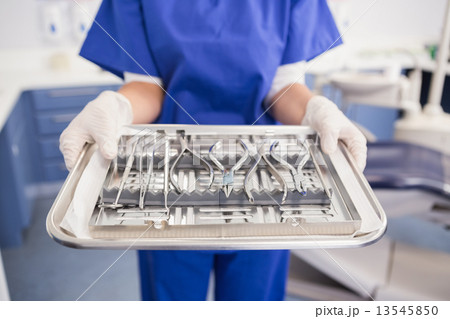 Dentist holding tray with equipment 13545850