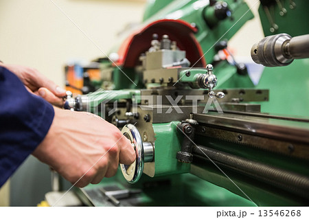 Engineering student using heavy machinery 13546268