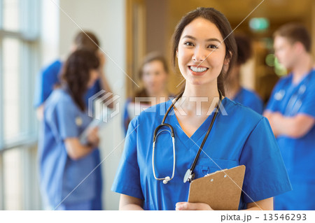 Medical student smiling at the camera Medical student smiling at the camera 13546293