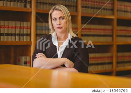 Serious lawyer looking at camera with arms crossed 13546766