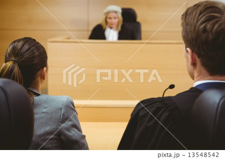 Judge talking with lawyers to make a decision Judge talking with lawyers to make a decision 13548542