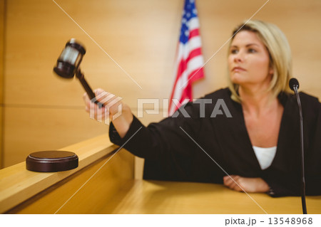 Judge about to bang gavel on sounding block Judge about to bang gavel on sounding block 13548968