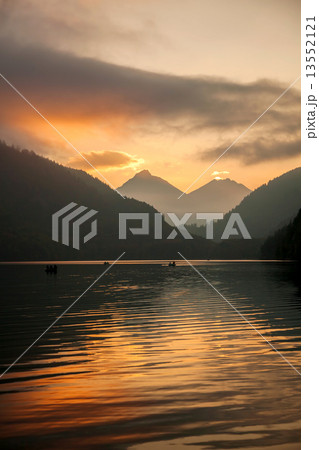 Schwangau lake in Bavaria Alps against sunset, Germany 13552121