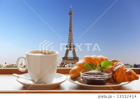 Coffee and croissants against Eiffel Tower in Paris, France 13552414