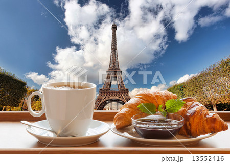 Coffee and croissants against Eiffel Tower in Paris, France 13552416