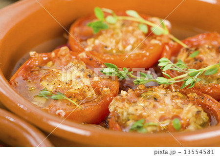 Tomates al Ajillo (Tomatoes with garlic). Spanish tapas dish.  13554581