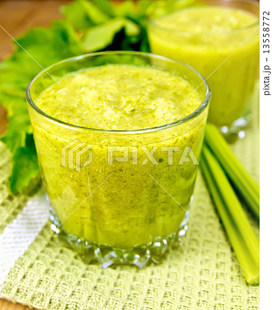 Cocktail with celery on napkin and board Cocktail with celery on napkin and board 13558772