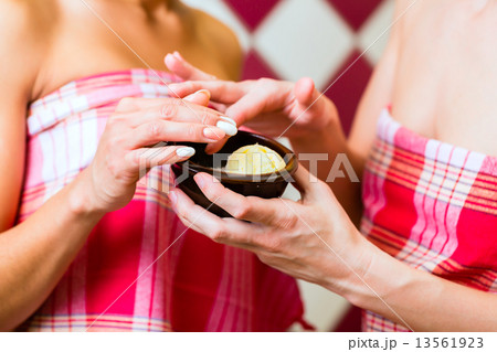 Women in Hammam vapour bath with wellness peeling Women in Hammam vapour bath with wellness peeling 13561923