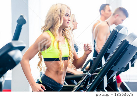 Treadmill group exercising in fitness gym 13563078