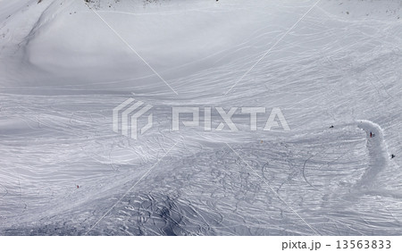 Skiers and snowboarders on off-piste slope in sun day Skiers and snowboarders on off-piste slope in sun day 13563833