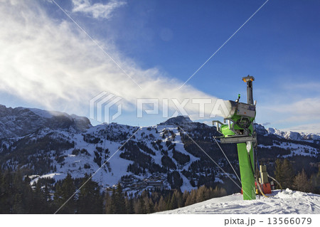 Makes artifical snow with snow gun 13566079