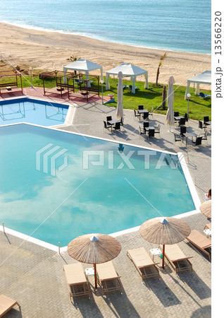 Swimming pool by a beach at the modern luxury hotel, Thassos isl Swimming pool by a beach at the modern luxury hotel, Thassos isl 13566220