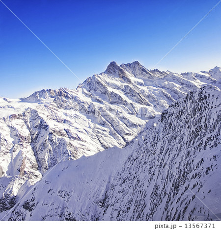 Jungfrau region peaks helicopter view in winter 13567371