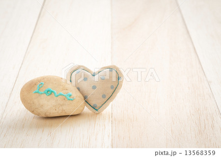 Cute handmade heart and glitter love word on stone Cute handmade heart and glitter love word on stone 13568359