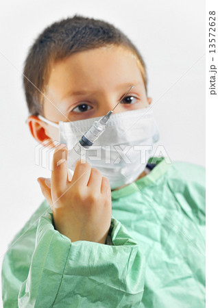 Boy in uniform giving injection Boy in uniform giving injection 13572628