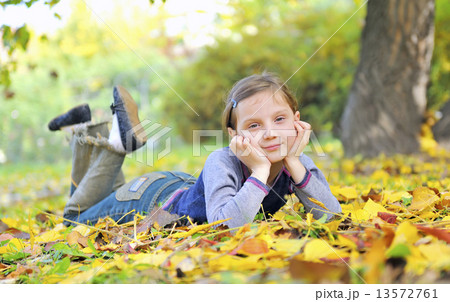little girl laying on the grass little girl laying on the grass 13572761