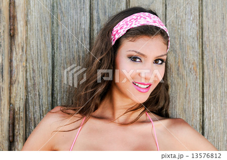 Attractive mixed woman with pink hair scarf Attractive mixed woman with pink hair scarf 13576812