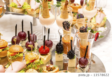 Canapes of cheese vegetables meat and seafood on white background Canapes of cheese vegetables meat and seafood on white background 13578622