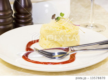 mashed potatoes with herbs and cheese on a white background in the restaurant mashed potatoes with herbs and cheese on a white background in the restaurant 13578870