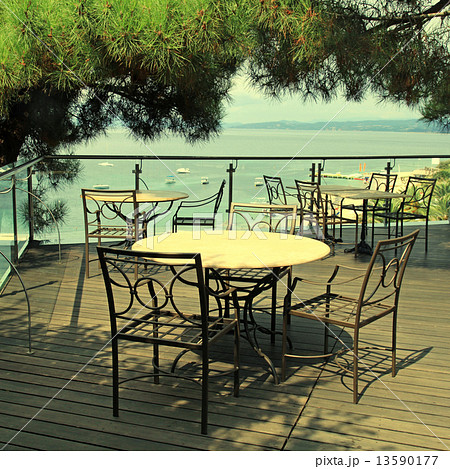 terrace outdoor cafe and sea view in Greece. 13590177