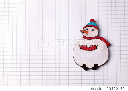 Handmade wood christmas decoration snowman on squared paper 13590183