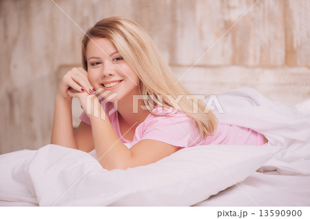 Beautiful woman waking up in the bed Beautiful woman waking up in the bed 13590900