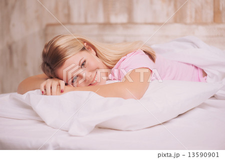 Beautiful woman waking up in the bed Beautiful woman waking up in the bed 13590901