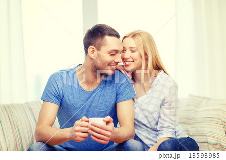 smiling man with cup of tea or coffee with wife smiling man with cup of tea or coffee with wife 13593985