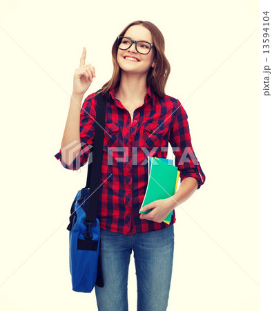 smiling female student with bag and notebooks 13594104
