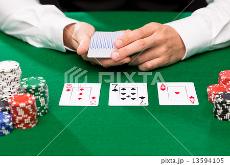 holdem dealer with playing cards and casino chips holdem dealer with playing cards and casino chips 13594105