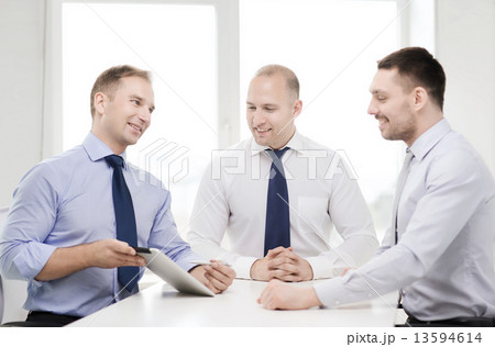 business team working with tablet pc in office business team working with tablet pc in office 13594614