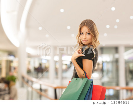 young happy woman with shopping bags in mall young happy woman with shopping bags in mall 13594615
