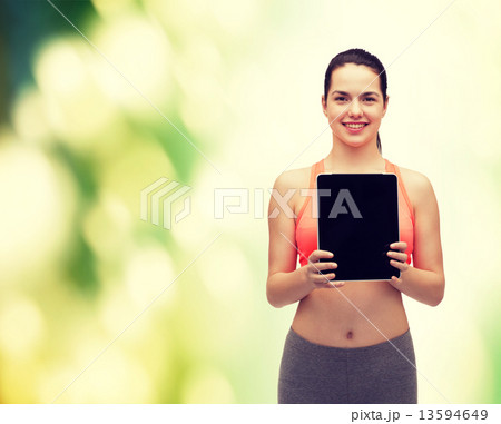 sporty woman with tablet pc blank screen sporty woman with tablet pc blank screen 13594649