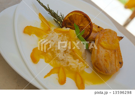 Healthy balanced lunch -chicken rice with rosemary and in orange sauce 13596298