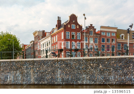 City view of Amsterdam canal and typical houses, Holland, Nether 13596515