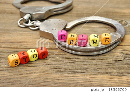 Sign Stop Crime and Handcuffs 13596709