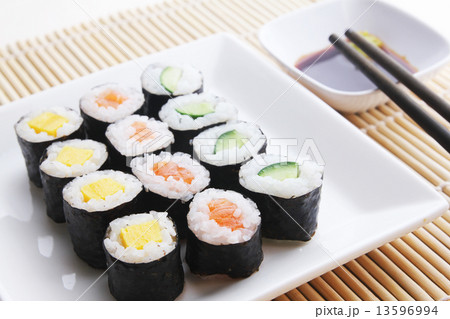 A plate of assorted japanese sushi 13596994