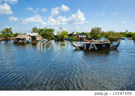 Floating House and Houseboat on the Tonle Sap lake, Cambodia. Floating House and Houseboat on the Tonle Sap lake, Cambodia. 13597309