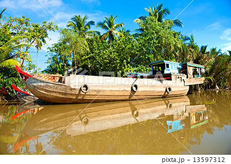 Boats in a harbor in the Mekong delta, Can Tho, Vietnam 13597312